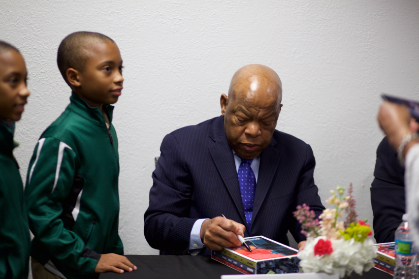 Representative John Lewis signing his book for a Huntsville elementary school student.